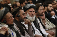 Afghan participants listen the speech of an Afghan politician during the opening session of Afghan Peace Conference in Bhurban, 65 kilometers (40 miles) north of Islamabad, Pakistan, Saturday, June 22, 2019. Dozens of Afghan political leaders attended a peace conference in neighboring Pakistan on Saturday to pave the way for further Afghan-to-Afghan dialogue. (AP Photo/Anjum Naveed)