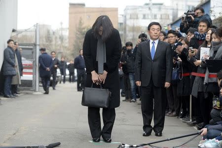 Cho Hyun-ah, also known as Heather Cho, daughter of chairman of Korean Air Lines, Cho Yang-ho, bows in front of the media outside the offices of the Aviation and Railway Accident Investigation Board of the Ministry of Land, Infrastructure, Transport, in Seoul December 12, 2014. REUTERS/Song Eun-seok/News1