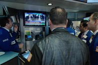 <p>Stock traders at the New York Stock Exchange watch former FBI Director James Comey on a television monitor, June 8, 2017, as he testifies before a congressional committee in Washington. (Mark Lennihan/AP) </p>