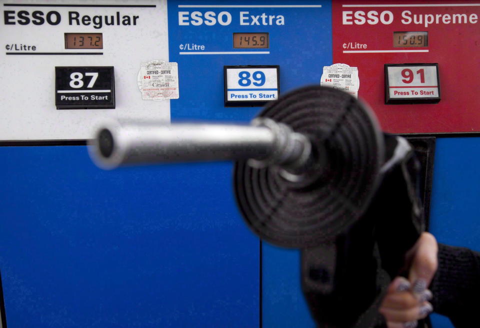 Gas prices are displayed as a motorist prepares to pump gas at a station in North Vancouver, B.C., Tuesday, May 10, 2011. Fuel marketer Parkland Corp. is reporting higher-than-expected second quarter earnings despite pandemic-related hits to its sales volumes, especially in its recently acquired Caribbean gas stations. THE CANADIAN PRESS/Jonathan Hayward