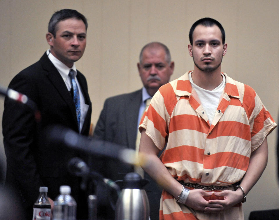 In this Aug. 30, 2012 file photo, Pvt. Isaac Aguigui walks into the courtroom during a preliminary hearing at Long County Superior Court in Ludowici, Ga. Army prosecutors plan to reveal why a Georgia-based soldier accused of leading an anti-government militia group has also been charged with killing his pregnant wife two years ago. A legal hearing at Fort Stewart for 21-year-old Pvt. Isaac Aguigui is scheduled to begin Monday, July 1, 2013. (AP Photo/Stephen Morton, File)