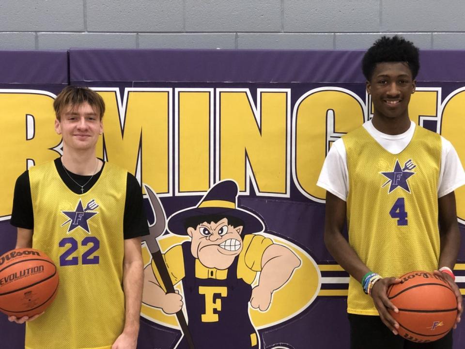 Farmington senior Logan Morse, left, and junior Keauntrey Barnes pose at a recent practice. A video of an alley-oop from Morse to Barnes during Tuesday's game against Havana has over 4,500 views on Twitter.