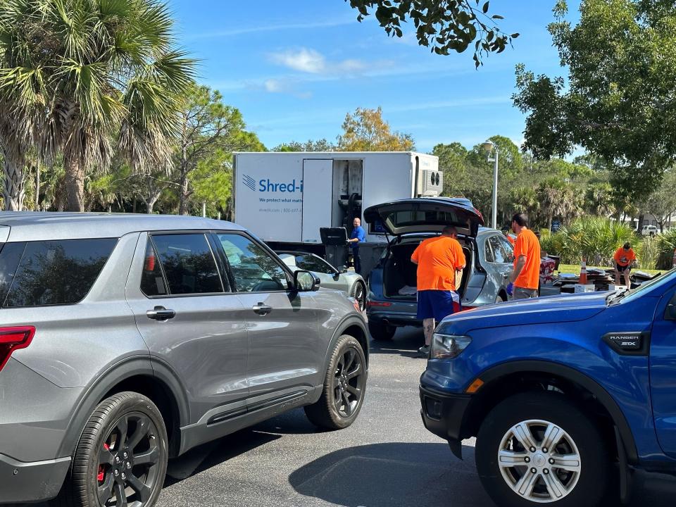 Clerk employees help Lee County residents dispose of their confidential documents on Saturday, Nov. 4, at "The Big Shred" event.