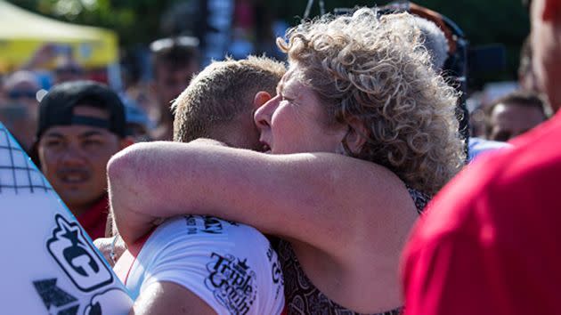 Fanning hugs his mother after competing. Image: Getty