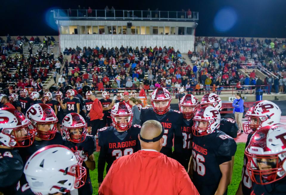 Pekin coach Doug Nutter talks with his defense during a game this season against Metamora. Pekin is playing this week in its first quarterfinal since 1988.