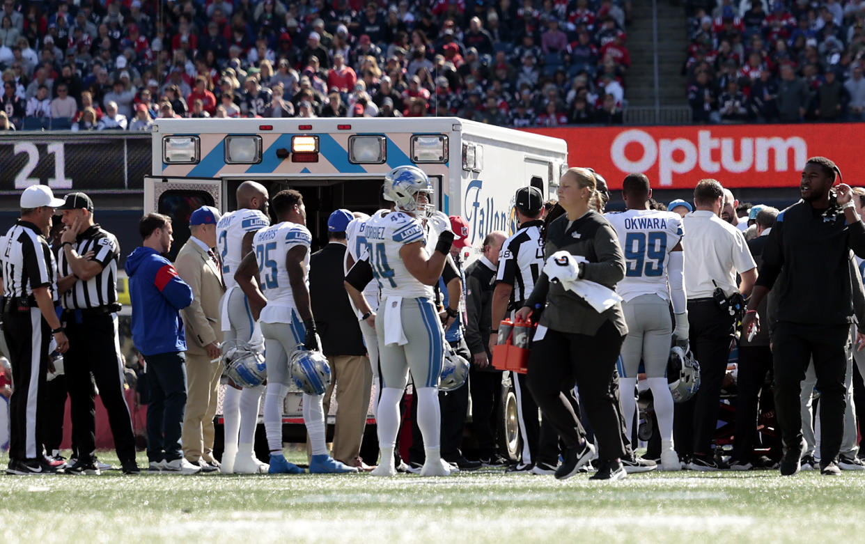 Detroit Lions players gather on the field as cornerback Saivion Smith is taken off the field in an ambulance. (Photo by Nick Grace/Getty Images)