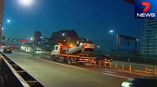 A driver is in shock after flipping his car on Sydney's Harbour Bridge this morning. Photo: 7News