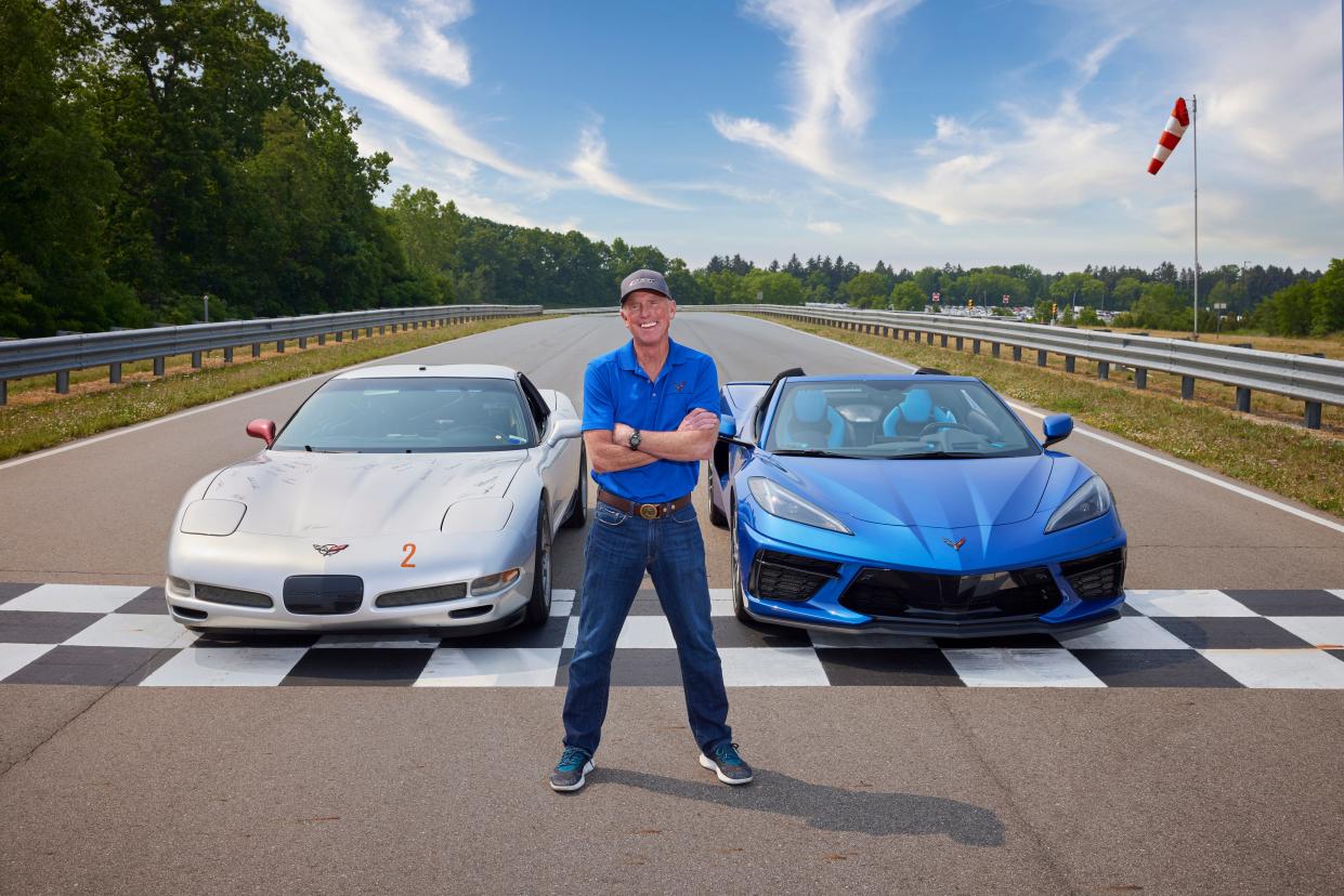 Corvette Executive Chief Engineer Tadge Juechter stands with two Corvettes. Juechter will retire in the summer of 2024 after 47 years with General Motors.