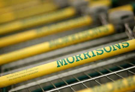 Shopping trolleys stand outside a Morrisons supermarket in Liverpool, northern England March 12, 2015. REUTERS/Phil Noble