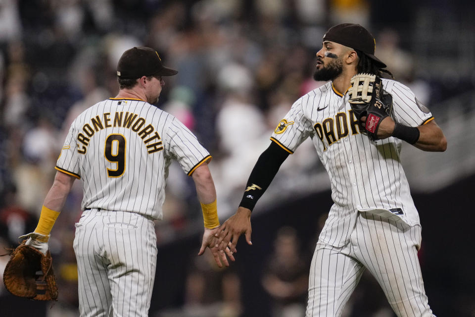 San Diego Padres right fielder Fernando Tatis Jr., right, celebrates with teammate first baseman Jake Cronenworth after the Padres defeated the Baltimore Orioles 5-2 in a baseball game Wednesday, Aug. 16, 2023, in San Diego. (AP Photo/Gregory Bull)