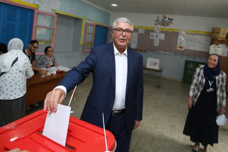 Tunisian Minister of Defense and presidential candidate Abdelkarim Zbidi, casts his vote at a polling station during presidential election in Sousse