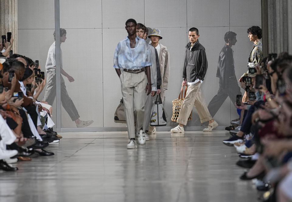 Models wear creations for the Hermes Menswear Spring/Summer 2024 fashion collection presented in Paris, Saturday, June 24, 2023. (AP Photo/Michel Euler)