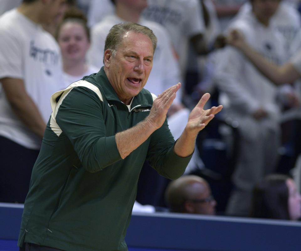 Michigan State coach Tom Izzo applauds during the first half of the team's NCAA college basketball game against Penn State, Wednesday, Dec. 7, 2022, in State College, Pa.