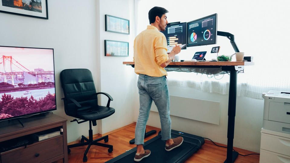 Man using under-desk treadmill