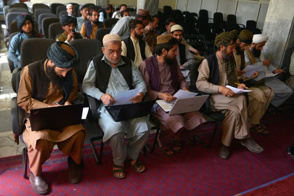 In this photo taken on June 5, 2022, members of the Taliban attend a computer science class at the Ministry of Transport and Civil Aviation in Kabul. - Since the Taliban swept back to power in August 2021, hundreds of fighters have returned to school -- either on their own, or pushed by their commanders.