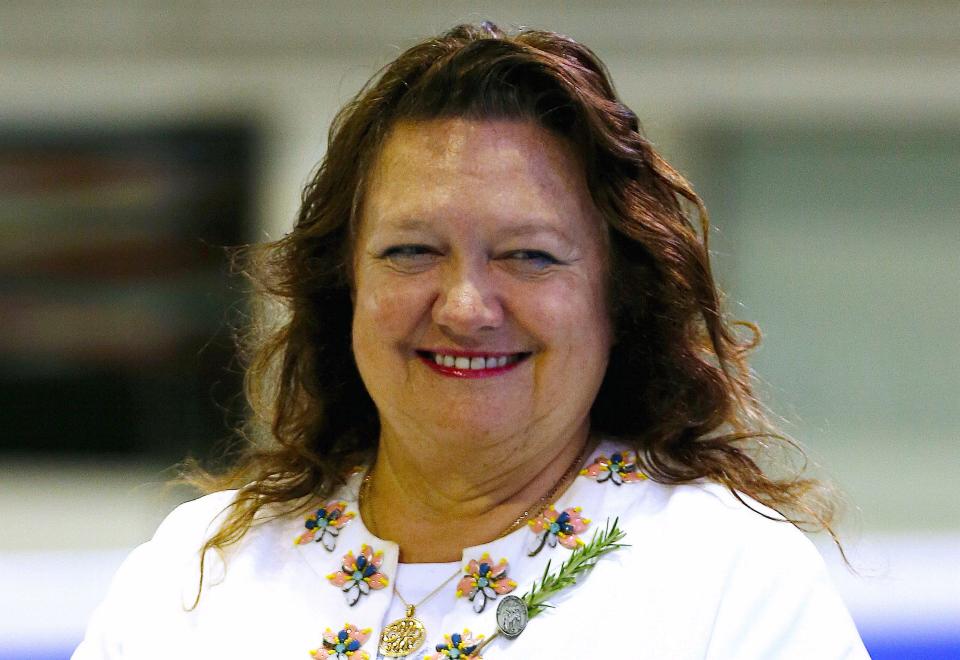 Chairman of Hancock Prospecting group Gina Rinehart prepares to award medals to competitors at Australian Synchronised Swimming Championships in Sydney 2016