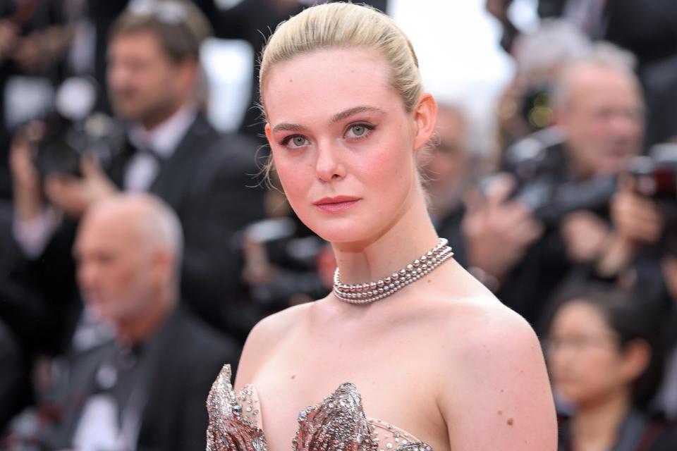 Elle Fanning attends the "Jeanne du Barry" Screening & opening ceremony red carpet at the 76th annual Cannes film festival at Palais des Festivals on May 16, 2023 in Cannes, France.