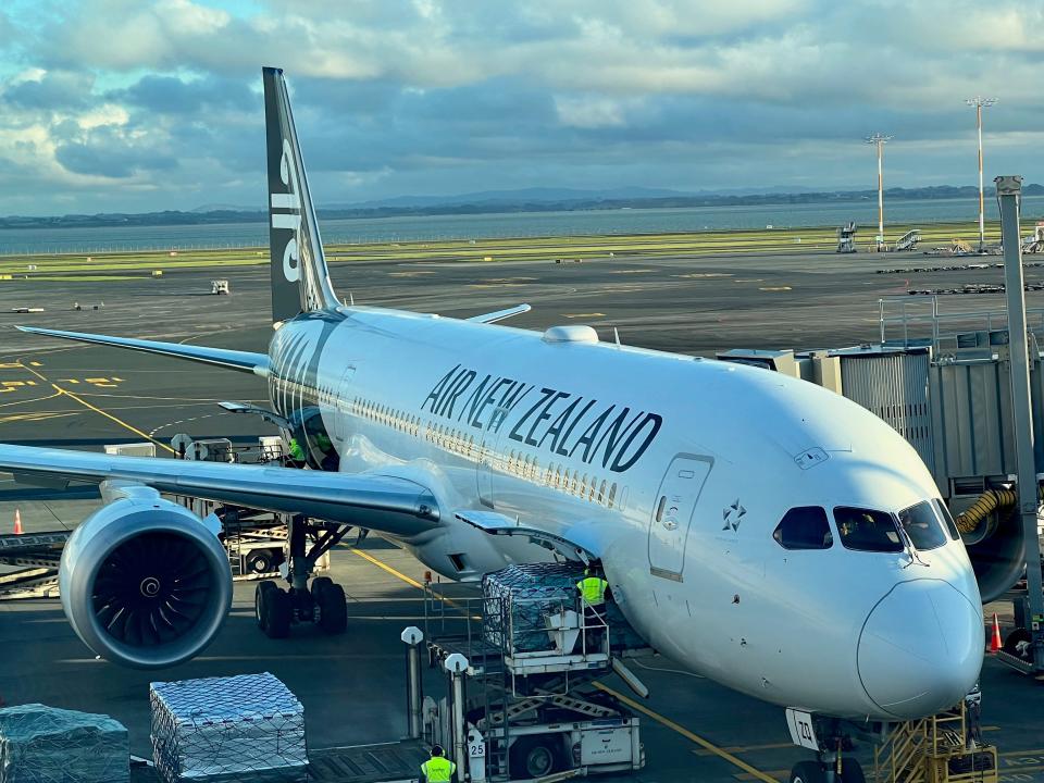 An Air New Zealand Boeing 787 on a runway in Auckland International Airport.
