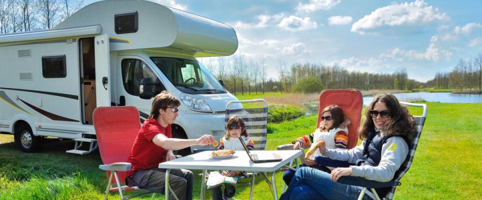 Family vacation, RV (camper) travel with kids, happy parents with children on holiday trip in motorhome