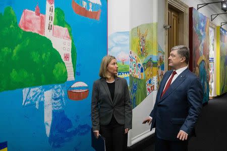 Ukrainian President Petro Poroshenko (R) speaks with European Union Foreign Policy Chief Federica Mogherini during a meeting in Kiev, Ukraine March 12, 2018. Mikhail Palinchak/Ukrainian Presidential Press Service/Handout via REUTERS