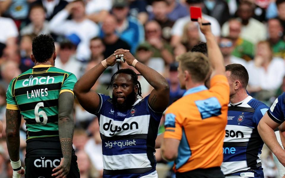 Referee Christophe Ridley shows Beno Obano the red card