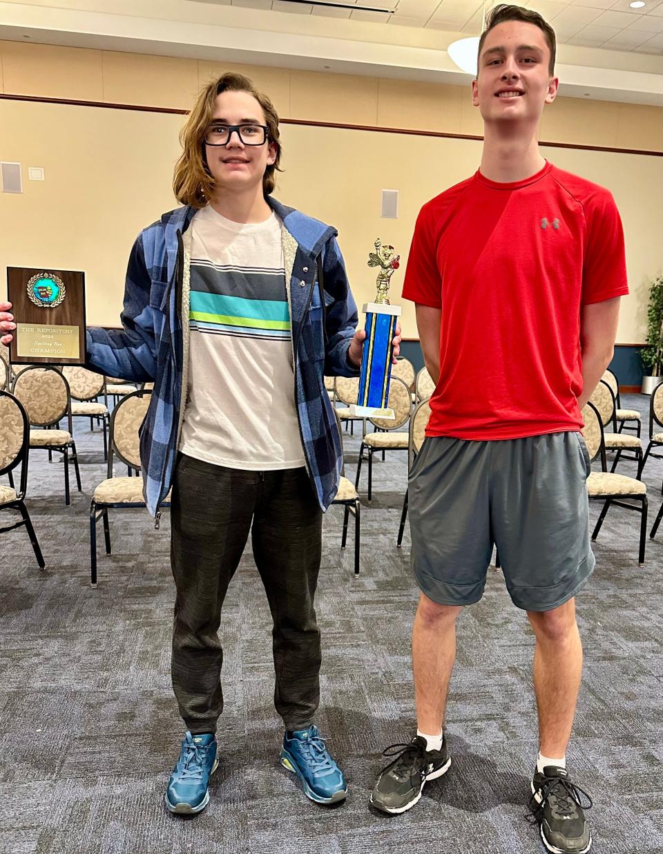 Logan Cox, left, winner of the 2024 Canton Repository Regional Final Spelling Bee on Saturday, March 16, 2024, at Kent State University's Conference Center, got a chance to chat with Bryce Beckley, right, who won the 2023 regional bee. Beckley went on to compete in May 2023 in the Scripps National Spelling Bee.