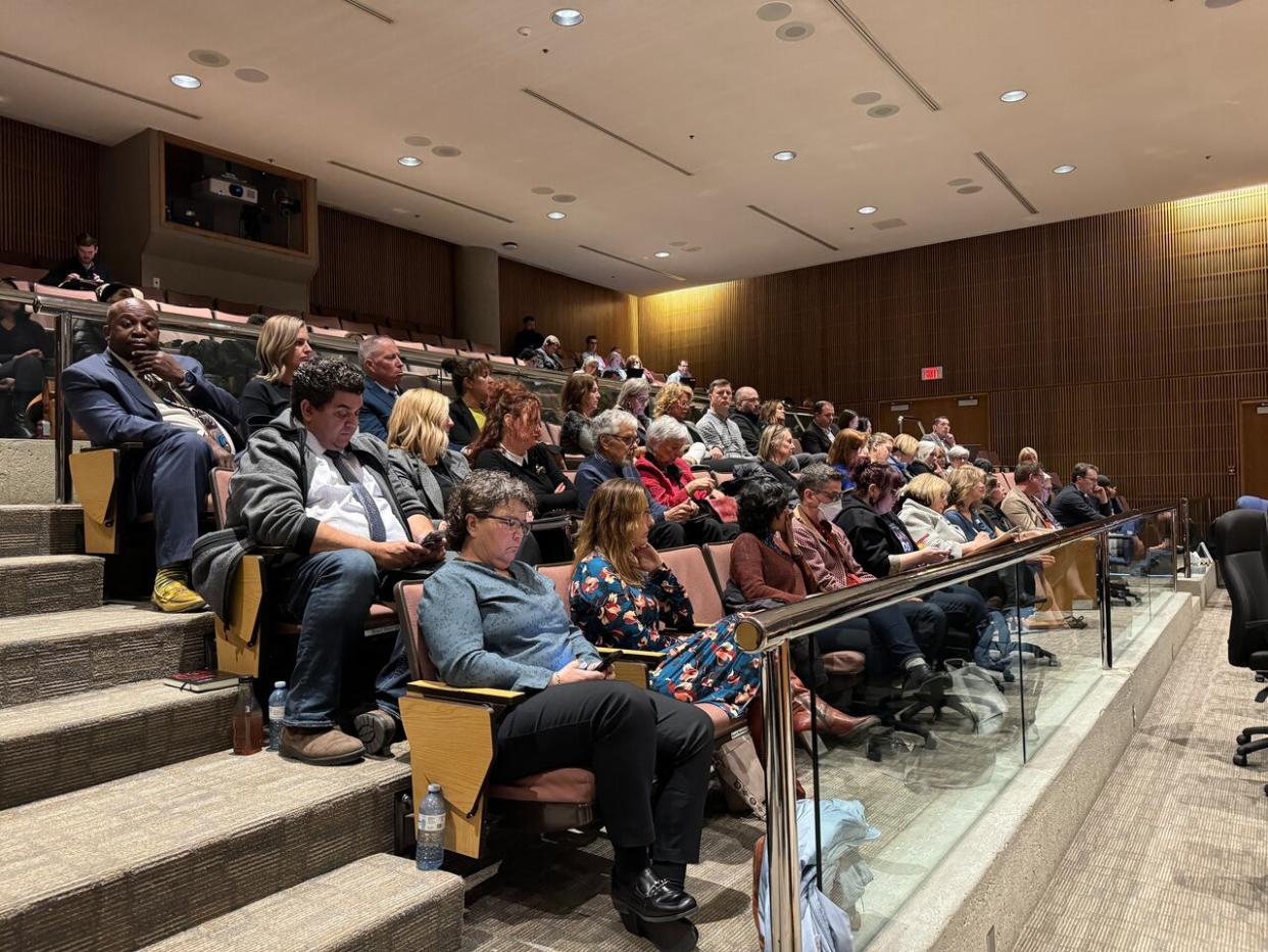 Part of an audience gathered at an Edmonton Public School Board meeting Tuesday, April 30, where trustees decided to welcome police back into schools. (Janet French/CBC - image credit)
