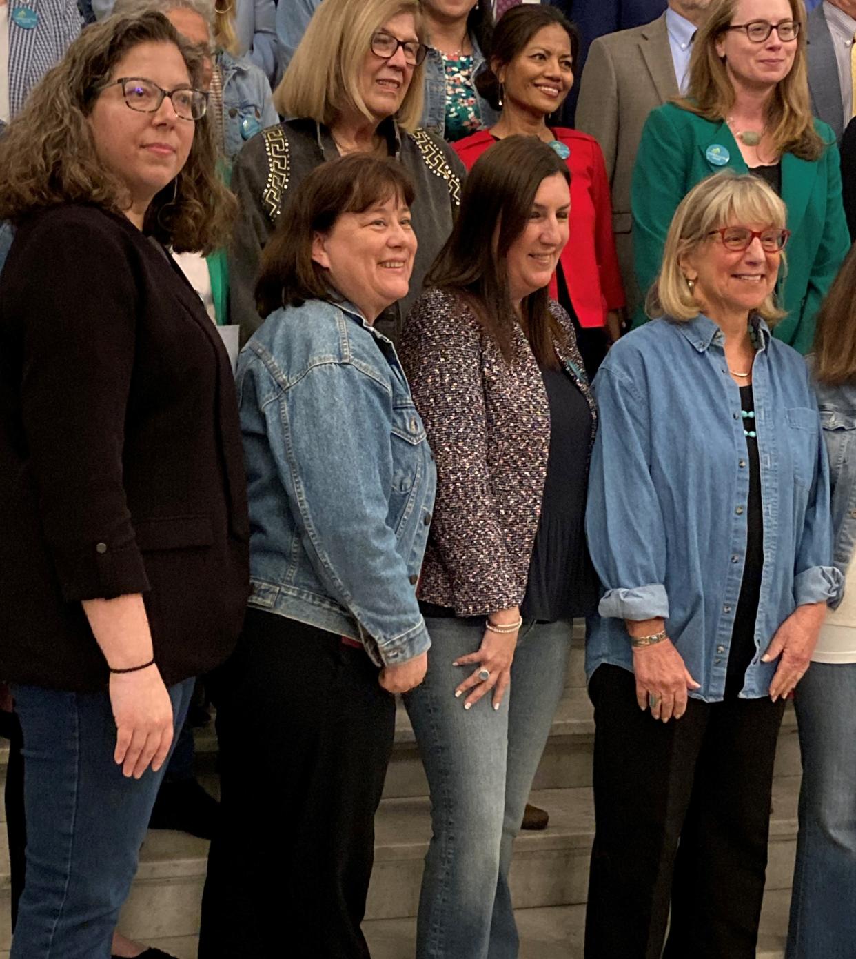 Legislators, from left, Rep. Natalie Higgins, D-Leominster, Rep. Trisha Farley-Bouvier, D-Pittsfield, Rep. Hannah Kahn, R-Shrewsbury and Senate President Karen Spilka, D-Ashland, wear their denim to mark Denim Day in solidarity with survivors of sexual assault and violence during Sexual Assault Awareness Month, celebrated in April.