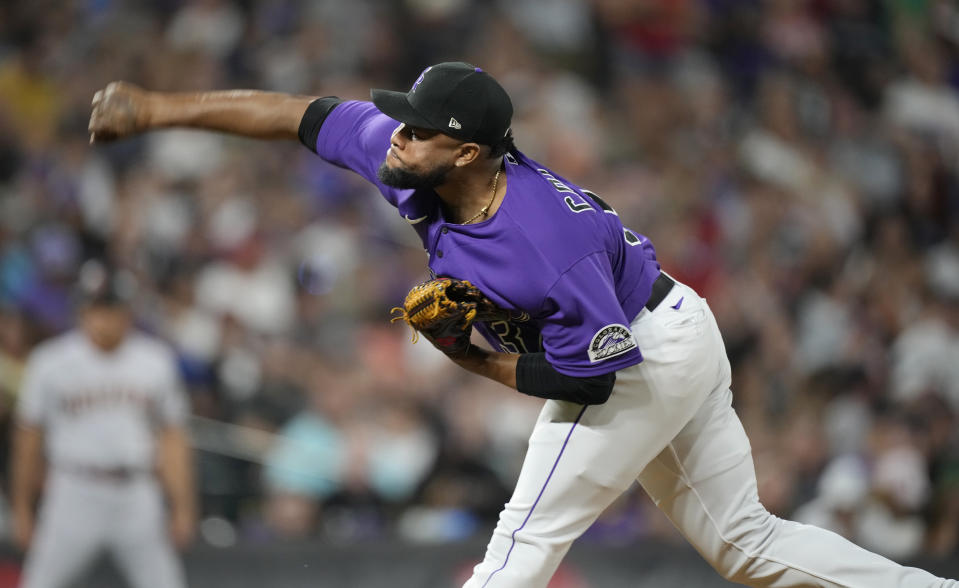 Colorado Rockies relief pitcher Alex Colome works against the Arizona Diamondbacks during the eighth inning of a baseball game Saturday, July 2, 2022, in Denver. (AP Photo/David Zalubowski)