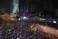 Israelis protest against the plans by Prime Minister Benjamin Netanyahu's new government to overhaul the judicial system, in Tel Aviv, Israel, Saturday, Jan. 28, 2023. (AP Photo/Tsafrir Abayov)