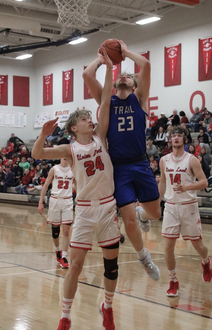 Buckeye Trail senior Garrett Burga (23) powers past Union Local's D.J. Butts for a basket during Tuesday's non-league game in Morristown.