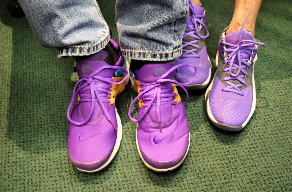 Percy Parsons has been known to wear bright athletic shoes. He and his wife, Holly, like the color purple and bought closely matching shoes.