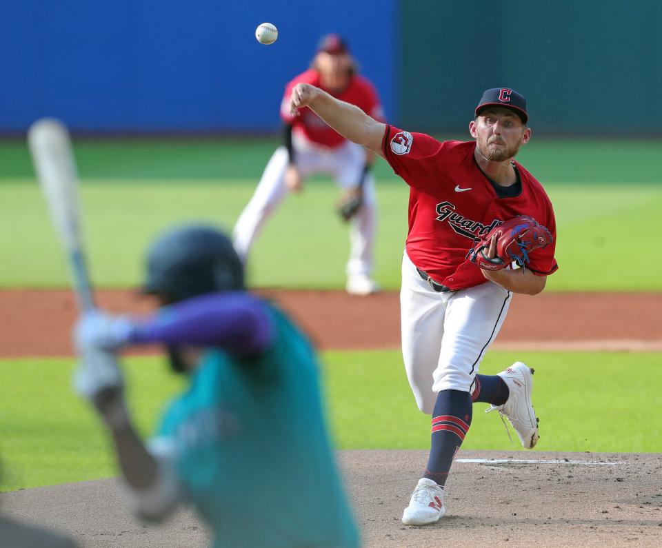 Cleveland Guardians starting pitcher Tanner Bibee (28) throws against the Seattle Mariners during the first inning Wednesday in Cleveland.