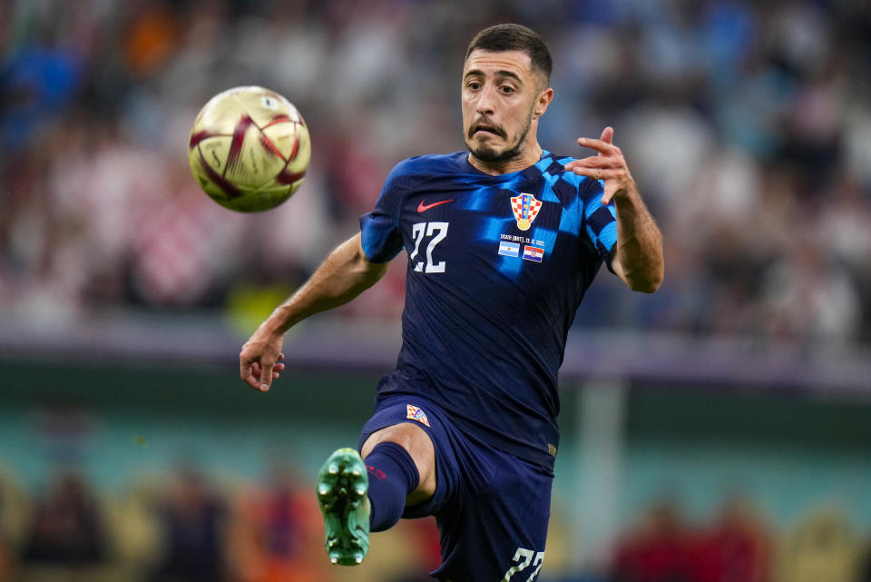 Croatia's Josip Juranovic attempts to control the ball during the World Cup semifinal soccer match between Argentina and Croatia at the Lusail Stadium in Lusail, Qatar, Tuesday, Dec. 13, 2022. (AP Photo/Petr David Josek)