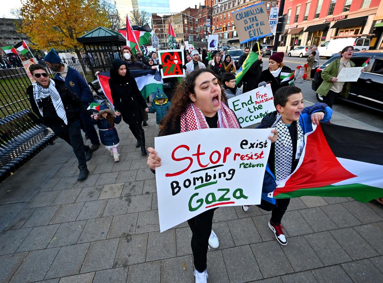 Siblings of Palestinian descent Sabah, 20, and Yousef Hammad, 11, of Worcester lead a Free Palestine rally on a march through downtown Worcester Friday afternoon.