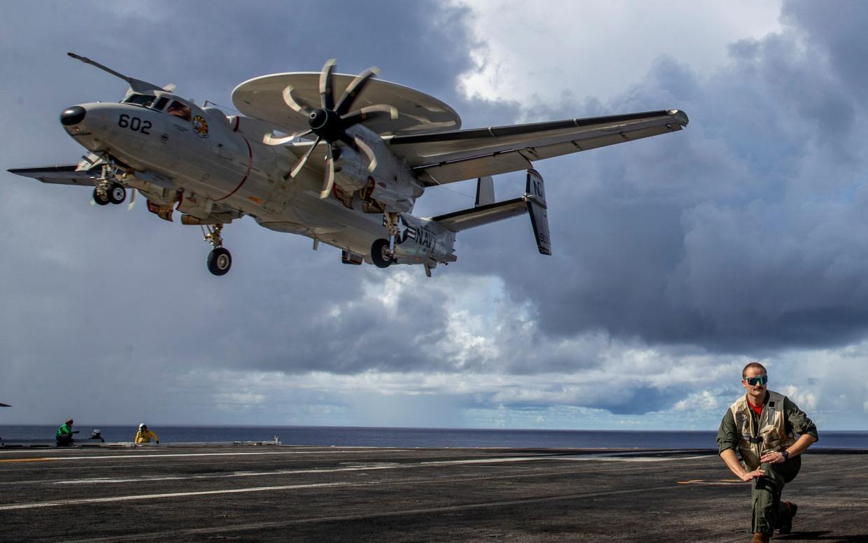 An E-2D Hawkeye radar aircraft comes in to land on the deck of aircraft carrier USS Abraham Lincoln last month. The Lincoln is believed to be operating in or near the southern Red Sea