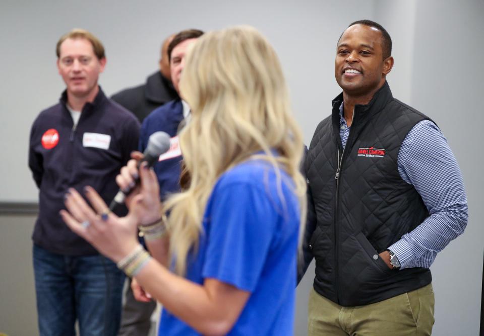 Attorney General Daniel Cameron listens to former UK swimmer Riley Gaines at a campaign stop in Shepherdsville on Wednesday, November 1, 2023