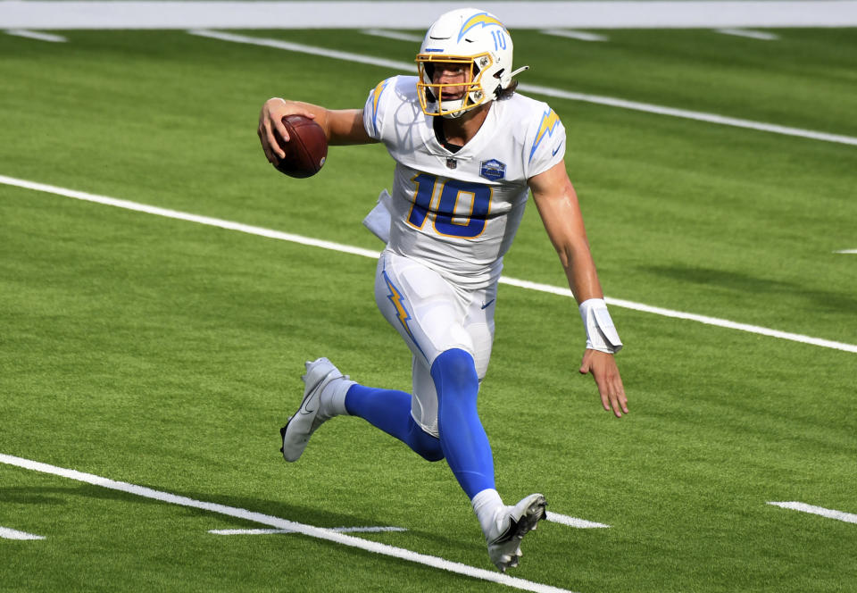 quarterback Justin Herbert #10 of the Los Angeles Chargers scrambles against the Kansas City Chiefs in the second half of a NFL football game at SoFi Stadium in Inglewood on Sunday, September 20, 2020. Kansas City Chiefs won 23-20 in overtime. (Keith Birmingham/The Orange County Register via AP)