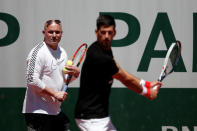 Tennis - French Open - Roland Garros - Paris - 25/05/2017. Novak Djokovic of Serbia and his coach Andre Agassi during a training session. REUTERS/Benoit Tessier