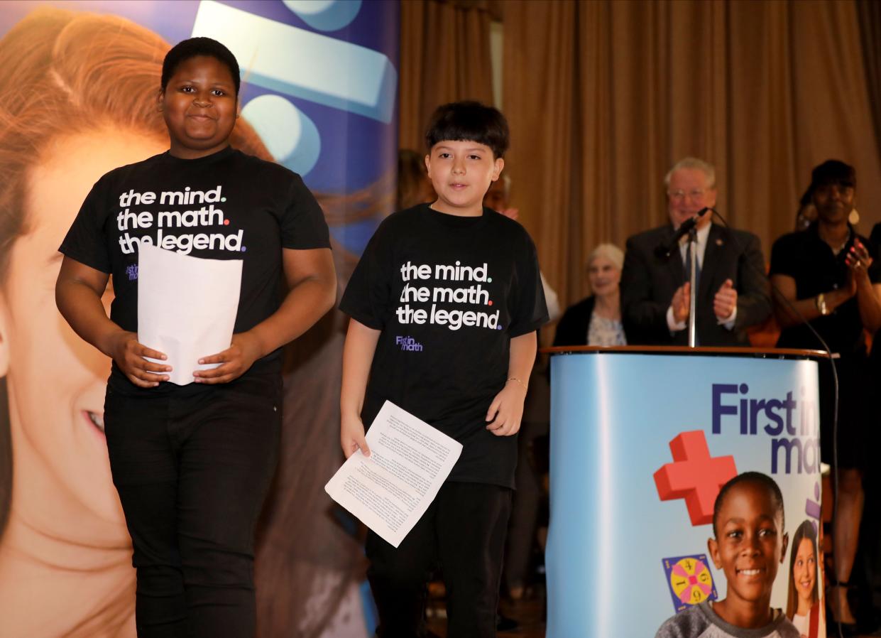 Top students John Delpe, left and Anderson Medina-Aguirre leave the stage after being recognized during an assembly held at Lime Kiln Elementary School in Wesley Hills May 3, 2024. They celebrated their accomplishment as tops in the nation for an online educational math game called First In Math. The games build confidence in math.