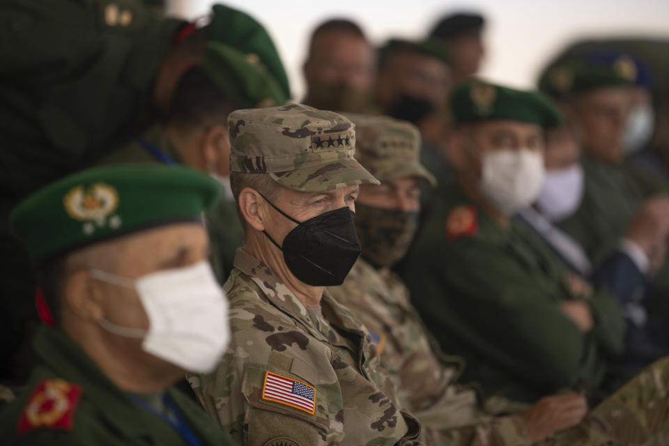 Gen. Stephen J. Townsend, head of the United States Africa Command, center, observes a large scale drill as part of the African Lion military exercise, in Tantan, south of Agadir, Morocco, Friday, June 18, 2021. The U.S.-led African Lion war games, which lasted nearly two weeks, stretched across Morocco, a key U.S, ally, with smaller exercises held in Tunisia and in Senegal, whose troops ultimately moved to Morocco. (AP Photo/Mosa'ab Elshamy)