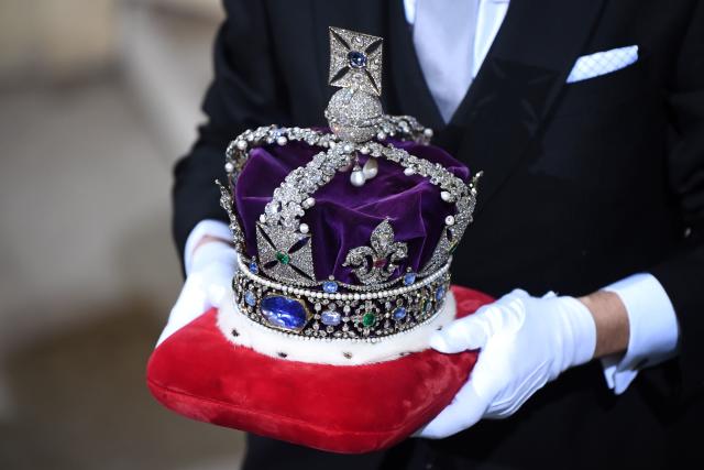 The Imperial State Crown is brought to the Sovereign&#39;s Entrance of the House of Lords for the State Opening of Parliament at the Houses of Parliament in London on December 19, 2019. - The State Opening of Parliament is where Queen Elizabeth II performs her ceremonial duty of informing parliament about the government&#39;s agenda for the coming year in a Queen&#39;s Speech. (Photo by Victoria Jones / POOL / AFP) (Photo by VICTORIA JONES/POOL/AFP via Getty Images)