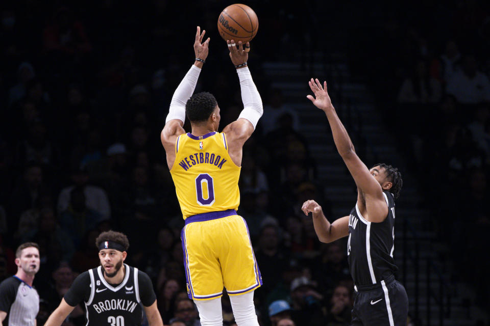 Los Angeles Lakers guard Russell Westbrook (0) shoots over Brooklyn Nets guard Cam Thomas, right, during the first half of an NBA basketball game Monday, Jan. 30, 2023, in New York. (AP Photo/Corey Sipkin)