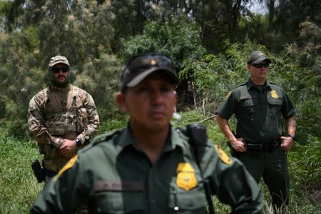 FILE PHOTO: U.S. Border Patrol agents are seen at the U.S.-Mexico border in Mission