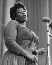 <p>One of the most famous jazz singers in history, Ella Fitzgerald made a name for herself with her incredible vocal range and collaborations with musicians like Louis Armstrong (on an <a href="https://www.youtube.com/watch?v=uEb4HzgILUU" rel="nofollow noopener" target="_blank" data-ylk="slk:entire duet album;elm:context_link;itc:0;sec:content-canvas" class="link ">entire duet album</a> in 1956.) Fitzgerald regularly made her performances feel extra special and formal by wearing costume jewelry and full-length gowns.<i> (Photo: Getty Images)</i></p>