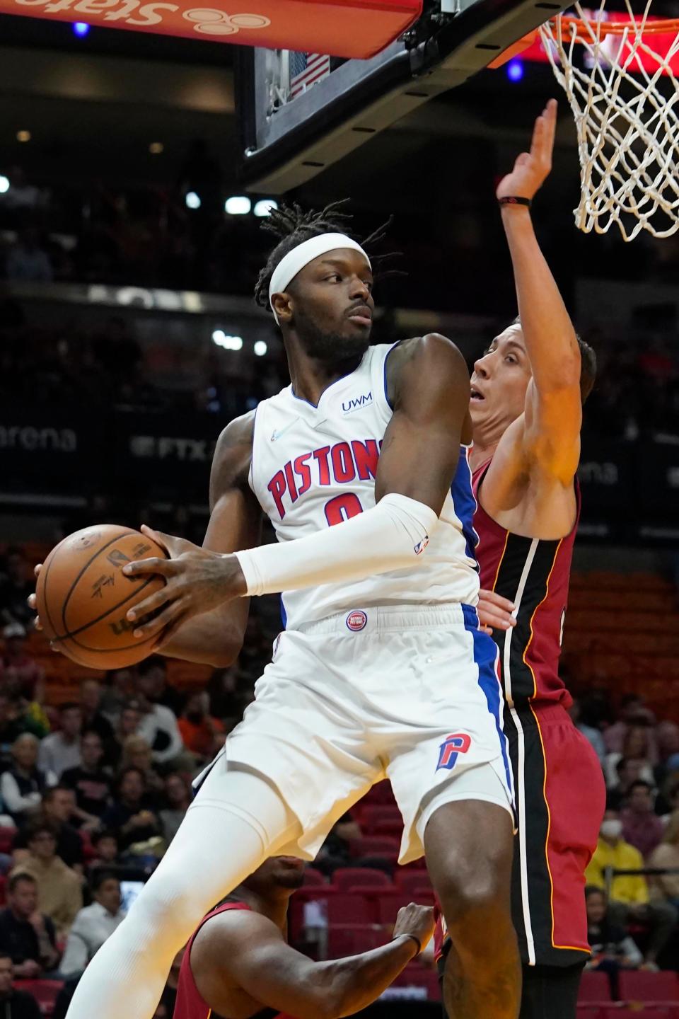 Detroit Pistons forward Jerami Grant looks to pass as Miami Heat guard Duncan Robinson defends during the first half on March 15, 2022, in Miami.