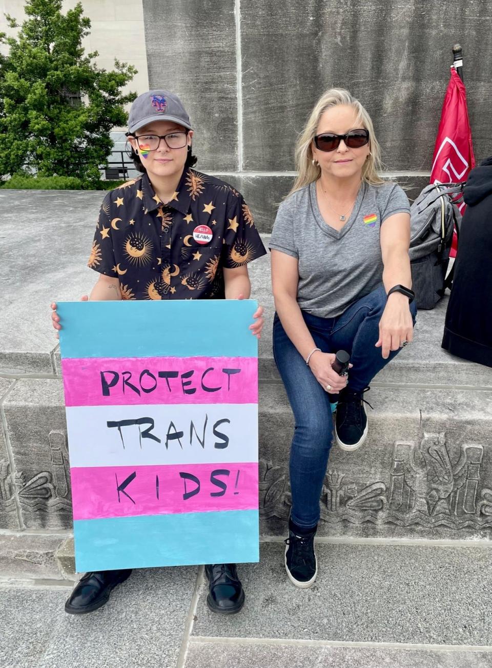 Gabby D., a transgender man from Metairie, and his mom Tina D., protest anti-LGBTQ legislation on April 12, 2023 at the Louisiana Capitol.