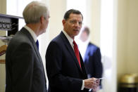 FILE - In this March 20, 2018, file photo, Sen. John Barrasso, R-Wyo., right speaks with Sen. Rob Portman, R-Ohio, after a Republican policy luncheon on Capitol Hill in Washington. On Tuesday, Aug. 21, 2018, Barrasso fended off a well-funded challenger in Wyoming's Republican primary and will face Wilson businessman Gary Trauner in the general election. Trauner ran unopposed for the Democratic nomination. (AP Photo/Jacquelyn Martin, File)