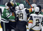 Dallas Stars defenseman Thomas Harley (55) and Vegas Golden Knights center Brett Howden, back, grapple during the first period of Game 6 of the NHL hockey Stanley Cup Western Conference finals Monday, May 29, 2023, in Dallas. (AP Photo/Gareth Patterson)