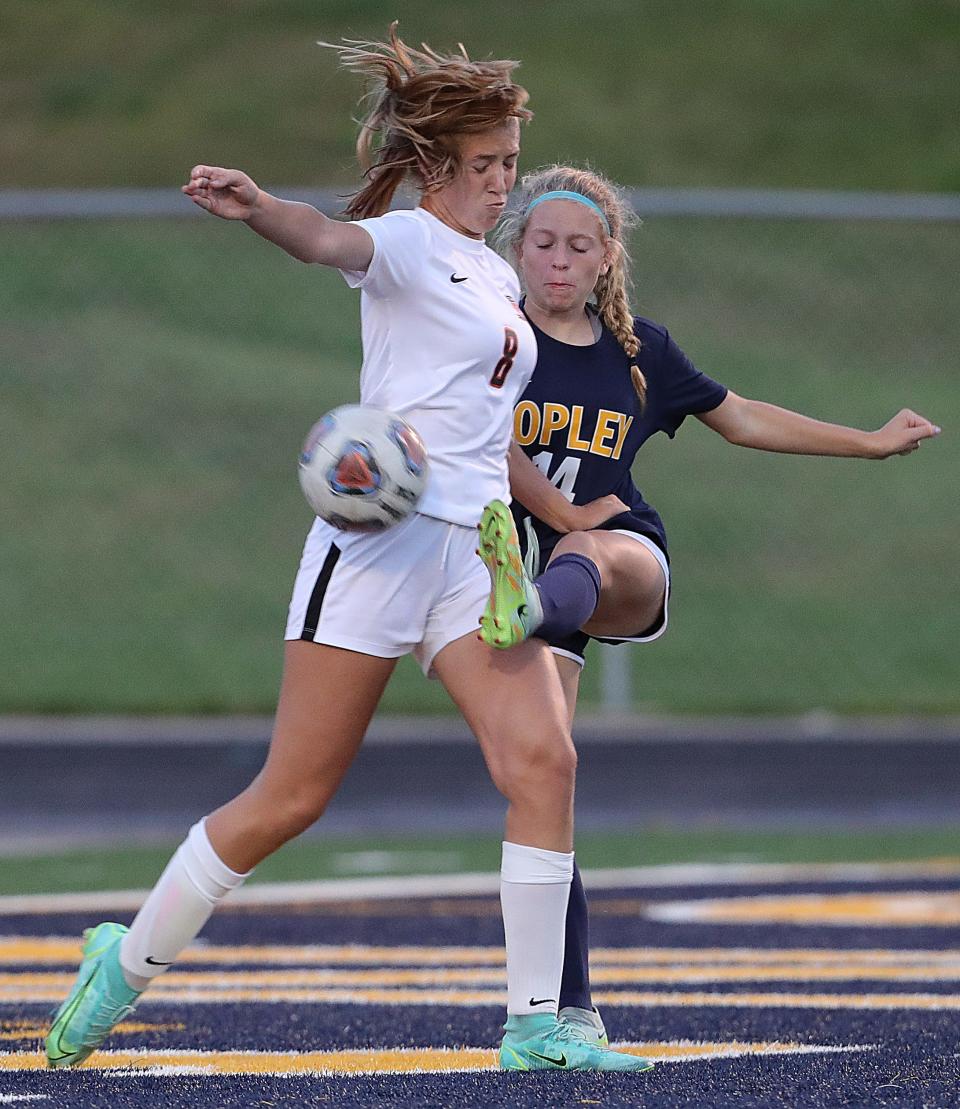 Copley Green's Sofia Durfee, left, looks to alter a first half shot by Copley's Sophie Arnold on Monday, Sept. 12, 2022 in Copley.